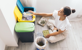 Woman recycling at home 2